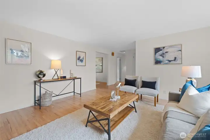 Spacious living area with clean lines, neutral finishes, and refinished floors throughout. A solid foundation ready for your design vision and future enhancements.