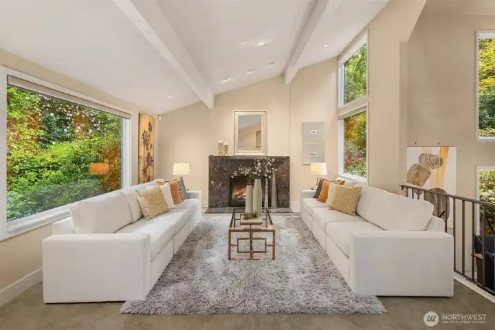 Anchored by the warmth of the fireplace, the living room invites intimate conversations, quiet moments, and a peaceful escape from the energy of the rest of the home.