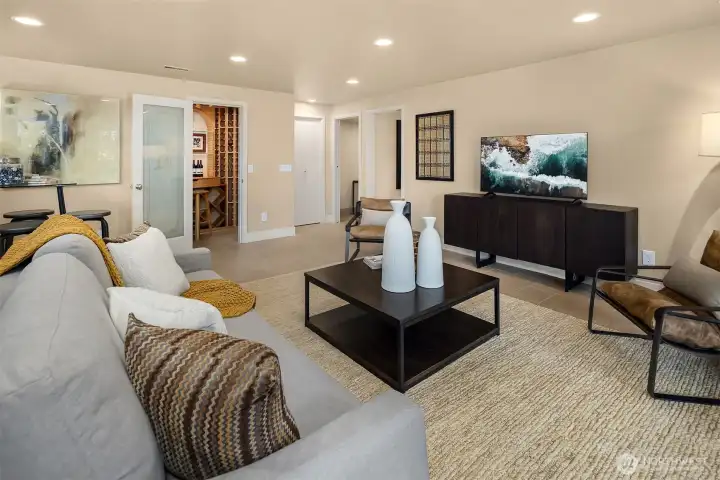 The loft-like office is spacious and filled with natural light, overlooking the backyard—a versatile and inspiring space that could easily serve as a library, den, or playroom.