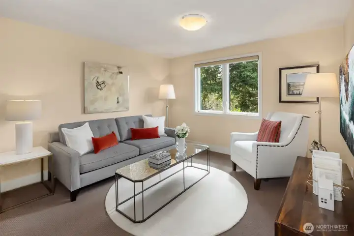 The primary suite offers its own private sitting area—more akin to a den or intimate family room—creating a true retreat. When we talk about a “primary suite,” this is exactly what we mean.