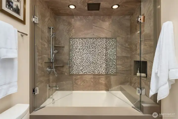 The renovation of this bathroom spared no expense, showcasing exceptional quality materials throughout.