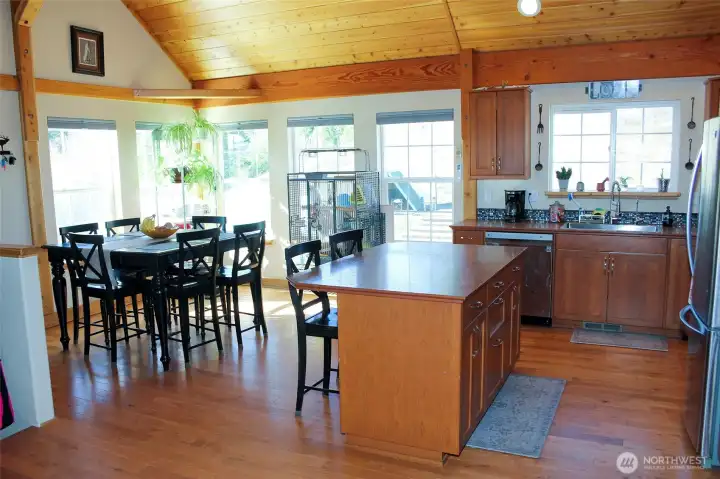 Kitchen overlooks an abundance of windows.