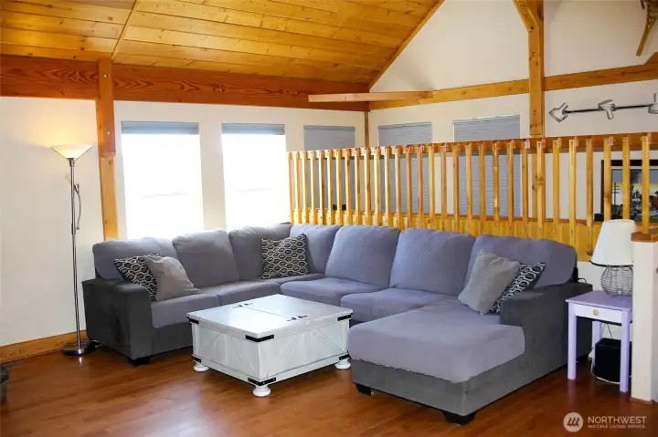 Expansive living area filled with natural light.