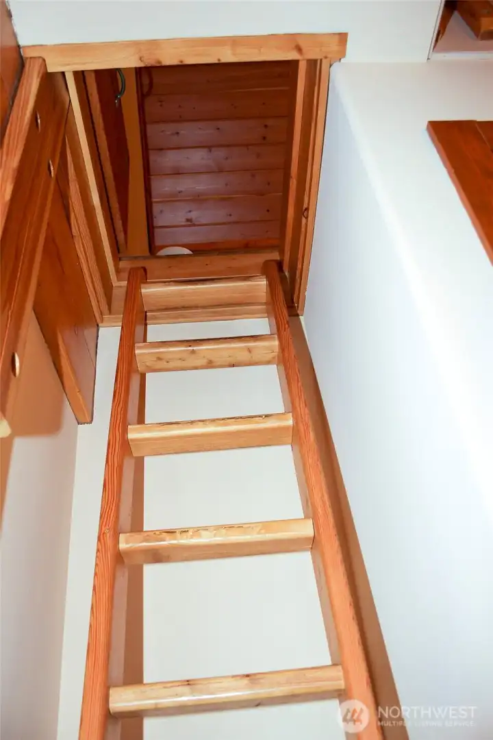 Staircase leading to upper-level loft and additional living space.