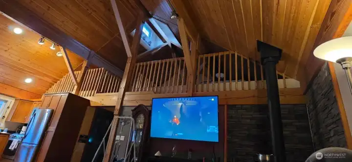 Upper-level loft with exposed beams and rustic character.