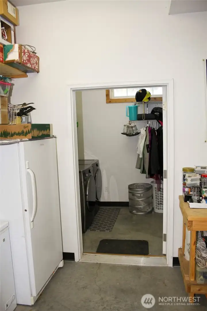 Laundry area with full-size washer and dryer for convenience.