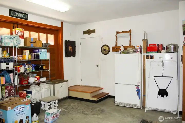 Organized shop area with shelving and workspace.