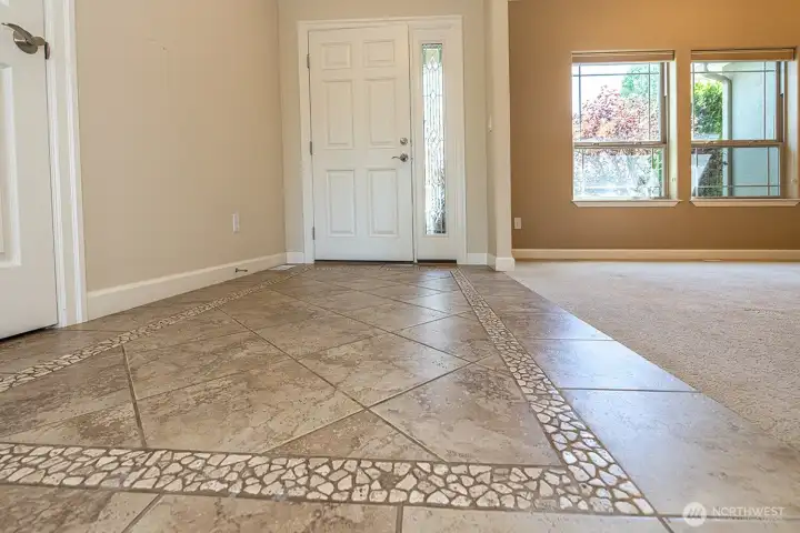 Tiled Entrance with coat closet