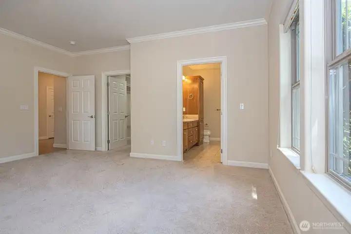 Primary suite with ensuite and closet room. Shades on all windows, these are room darkening.
