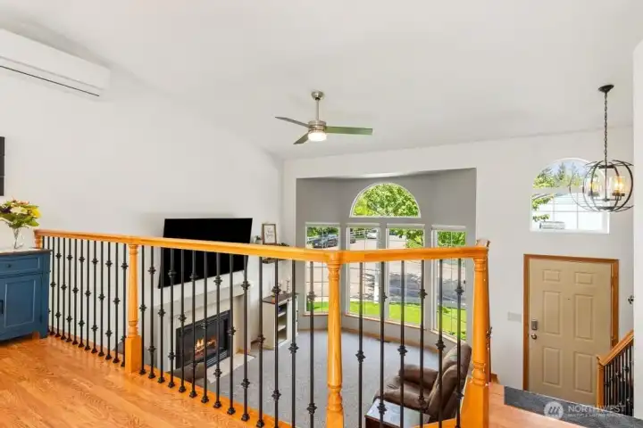 Vaulted ceilings and ceiling fan, view of living room from dining room/kitchen