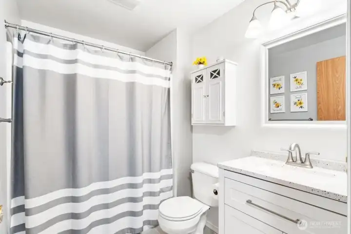 Full bathroom in main hallway on upper level