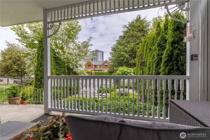 Private and peaceful view of the spacious porch and front yard from the living room window.