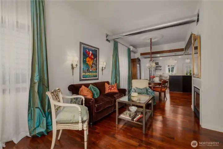 View from the living room towards the kitchen with lovely high ceilings.
