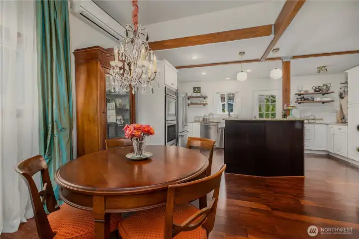 Currently situated dining space with vintage chandelier, could also be an expanded living room space