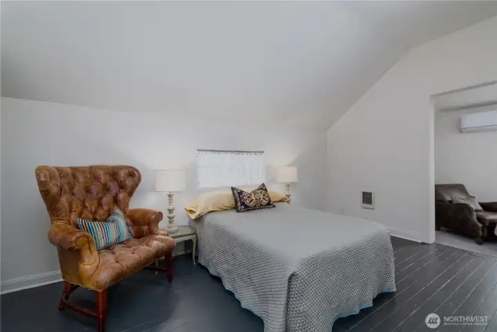 Large back bedroom with gabled ceiling and entry to a a light filled bonus room... possible private office, music room, library, etc.
