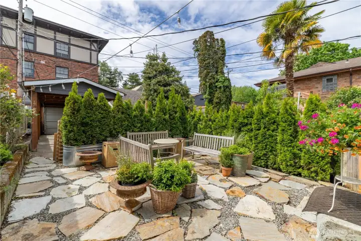 Large back patio with easy maintenance, drought resistant, landscaping. Perfect for entertaining and barbecues!