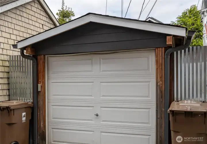 Well enclosed carport as seen from the back alley. Great security.