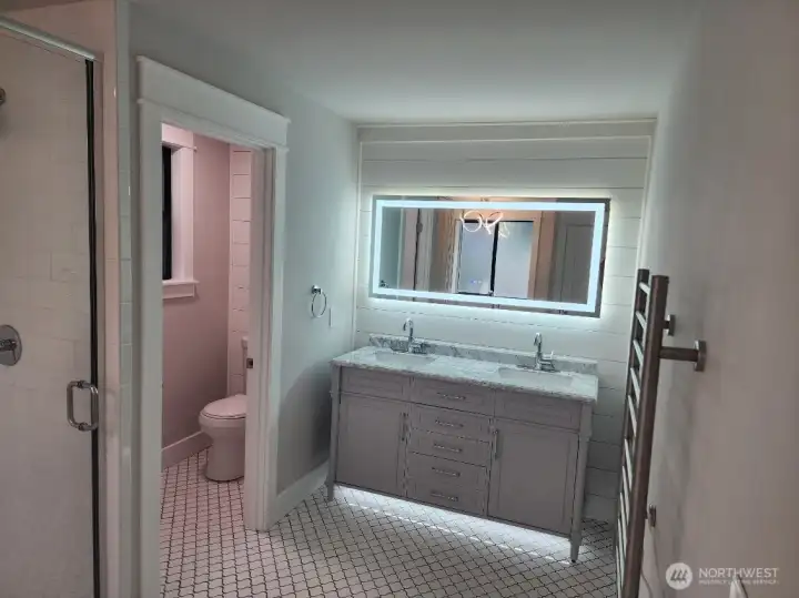 Lighted and heated vanity mirror