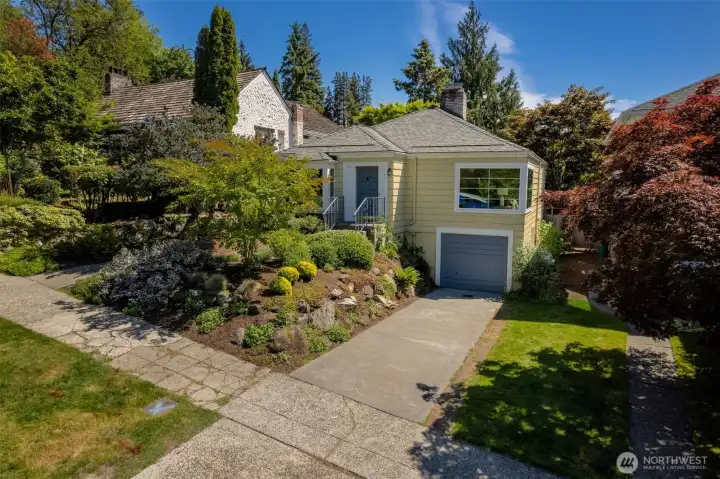 DREAMY LOCATION ALERT!! Opportunity Abounds in this Darling Laurelhurst Cape Cod! Just 40 steps from your front door to a secret pathway into Laurelhurst Park for summer camps, play, picnics, and endless pickleball. Secluded deadend street just off Laurelhurst's iconic boulevard! Charming 1937 details like coved ceilings, spacious living room, and proper and quaint dining room. 2 bedrooms + 3RD BEDROOM PRIMARY SUITE POTENTIAL in lower level. Lower level features bright and cozy rec room/office + room to expand. Walk to Children's, U Village, and nearby restaurants and shops along 45th/Sand Point. Get your nature fix just down the way with a stroll or a run in the lovely Center for Urban Horticulture with its endless surrounding trails and pathways along Lake WA - and don't miss the Burke-Gilman Trail nearby! Sweet, secluded, and mature backyard garden with perfect patio for whiling away the sunny days - all-season botanical interest nestles this cute-as-a-button home!