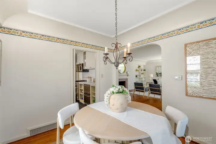Quaint, bright, proper dining room with bay window.