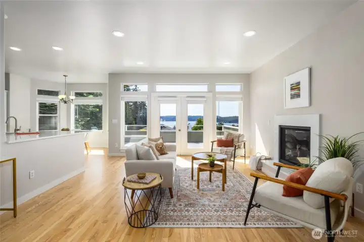Refinished ash hardwood floors, water views, gas fireplace, open concept kitchen to living areas. Refinished ash hardwood floors, water views, gas fireplace, open concept kitchen to living areas.