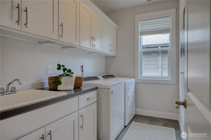 2nd floor laundry room with utility sink