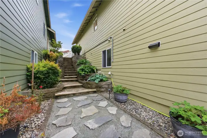 Walkway to and from the lower level or to the backyard Walkway to and from the lower level or to the backyard