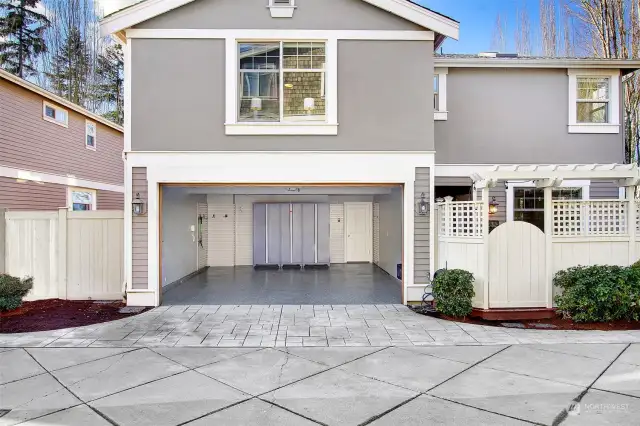 The garage of your dreams! Professionally installed high-end Floortex epoxied floors, slat walls for hanging storage, spacious storage lockers and freshly painted walls.