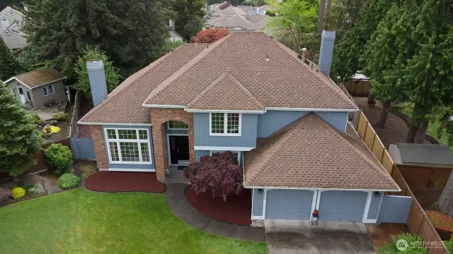 High-angle view highlighting the home’s setting