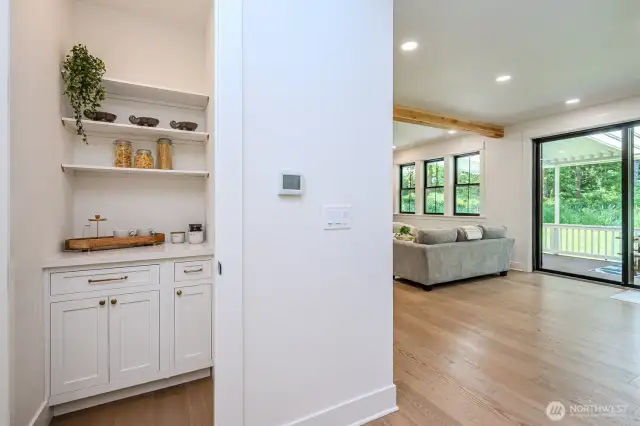 Walk-in pantry with built-in storage is such a great space for a coffee bar!