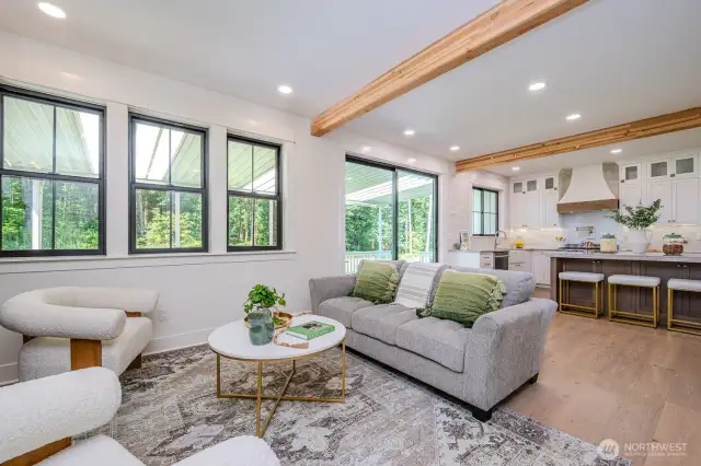 Thoughtfully designed living space with natural textures and warmth. Spacious seating area with 9 ft ceilings and abundant natural light.