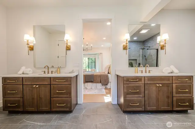 Spa-inspired primary bath with fabulous quartz topped vanities, LED mirrors & elegant brushed gold touches. Prepare to be pampered!