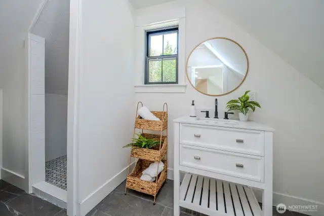 The barn door opens to the guest bath so chic and serene your visitors may just extend their stay!