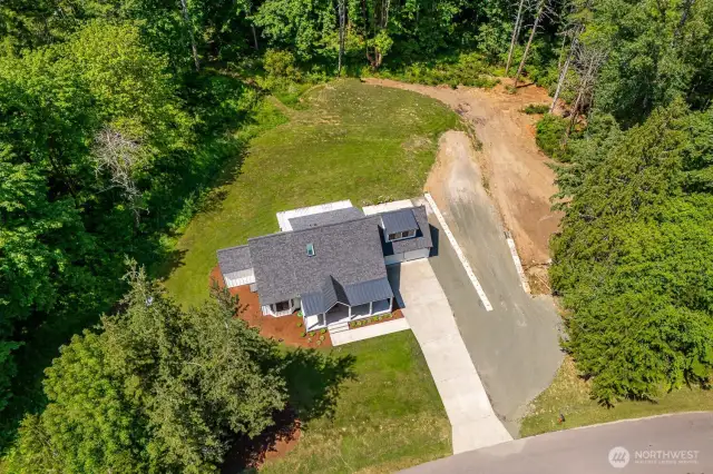This home offers more than just natural beauty--it offers room to grow!  The cleared area on the right would be a great spot for a shop and/or ADU!