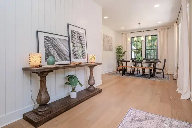 Entry opens to bright and spacious dining room with custom millwork, large windows, custom draperies, lighting and recessed lights. LOVE LOVE LOVE!!!