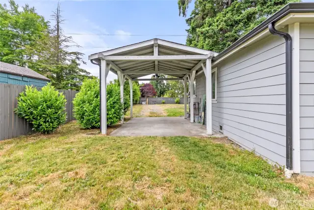View of covered carport from backyard