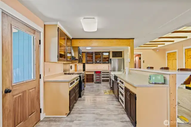 Kitchen with undercounter lighting and eating bar
