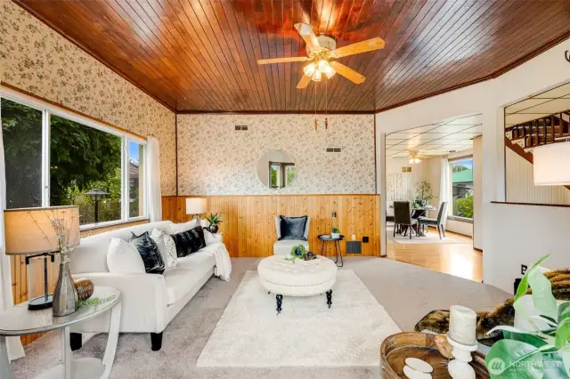A living room that stuns from every angle, especially overhead, where hardwood ceilings make a bold statement.