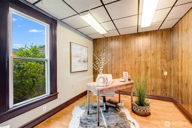 Conveniently located just off the dining room, this room is currently staged as a home office.