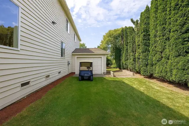 Drive from your home right on to the 11th Tee. Plenty of space for you to add a separate golf cart garage! Here is a rendering of adding a door to the garage. Other idea is to add on.