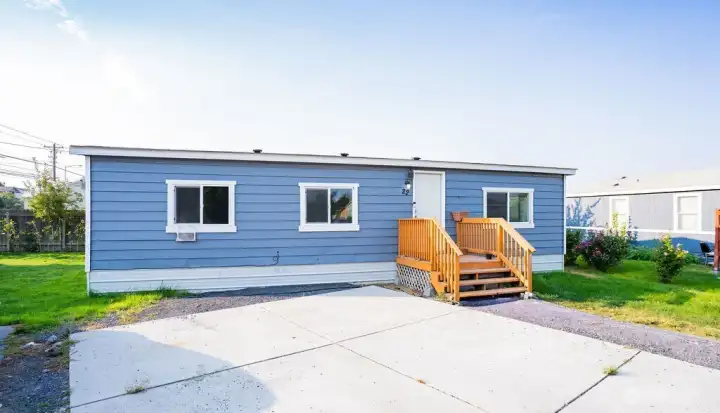 Front of home with 2 parking spots