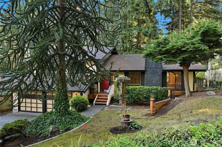 The front yard grass has a small putting green area