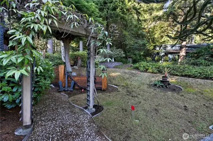 The front yard grass has a small putting green area