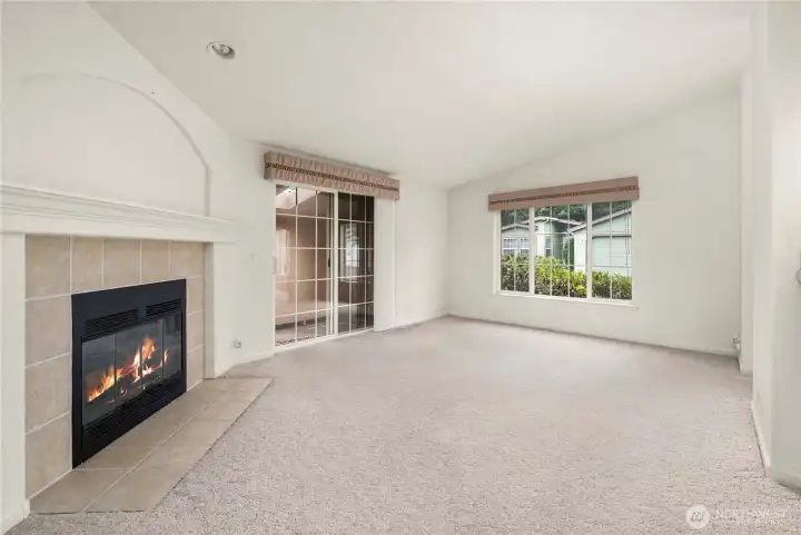 Slider exits to an enclosed patio.