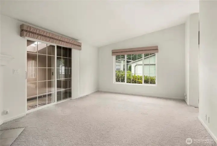 Closer view of the slider to the enclosed patio - complete with skylights to allow natural light in.