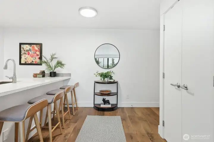 Open entryway with pantry/storage space.