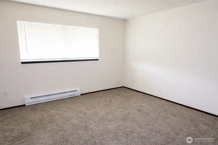 Bedroom number one at end of hall is a great size. *Photo is from prior to current tenancy, home is fairly cluttered currently*