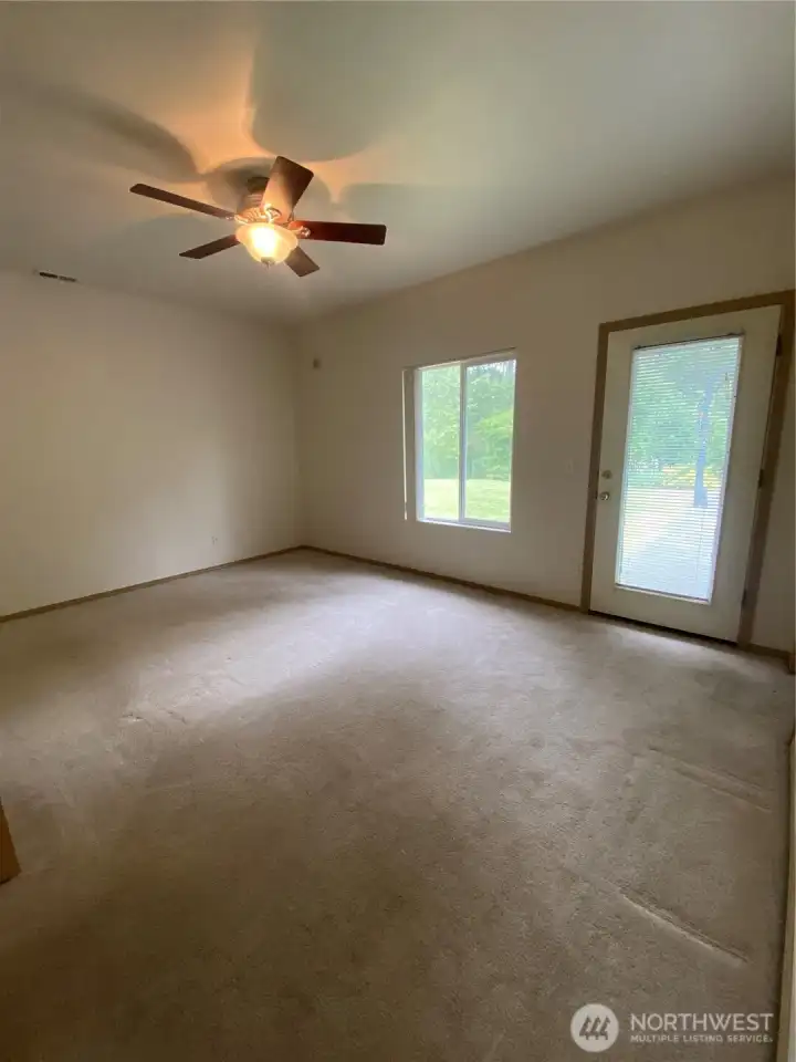 Primary bedroom with glass door that leads you outside to the private backyard! Primary bedroom with glass door that leads you outside to the private backyard!