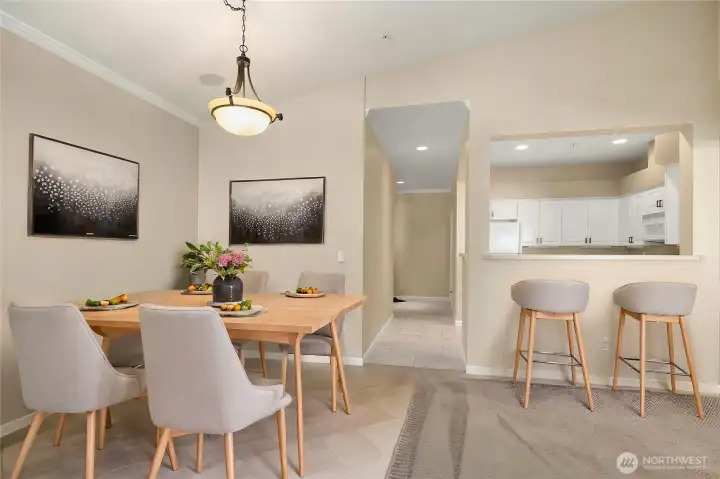 Nice dining space and eat at kitchen bar- virtually staged
