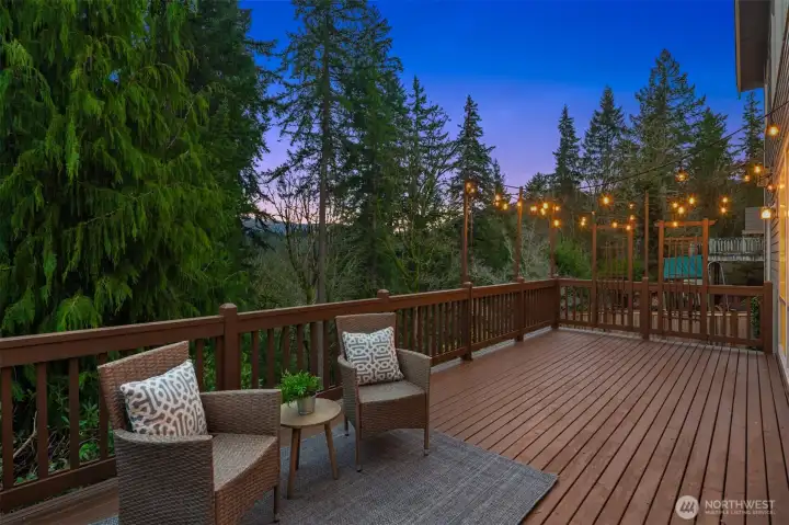 Large entertaining deck overlooks private greenbelt. Large entertaining deck overlooks private greenbelt.